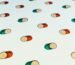 a group of pills floating in the air